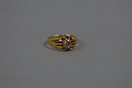 AN EARLY 20TH CENTURY 18CT GOLD SINGLE STONE DIAMOND GYPSY SET RING, estimated old European cut