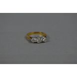 A LATE 20TH CENTURY THREE STONE DIAMOND RING, estimated total modern round brilliant cut weight 0.