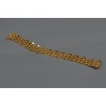 A LATE 20TH CENTURY WIDE PANEL LINK BRACELET, comprised of articulated interlocking chevron links,