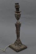 A LATE VICTORIAN SILVER CANDLESTICK, of square form, circular beaded sconce, embossed throughout