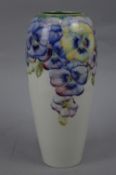 AN EARLY 20TH CENTURY WILLIAM MOORCROFT FOR MACINTYRE & CO BALUSTER VASE, decorated in a pale purple