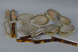 AN ELIZABETH II SILVER BACKED SIX PIECE DRESSING TABLE SET, engine turned decoration, makers