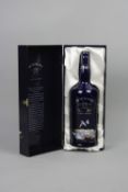 A BOTTLE OF BOWMORE 'BLUE BUCHAN', 22 YEAR OLD ISLAY SINGLE MALT WHISKY, in a ceramic decanter and