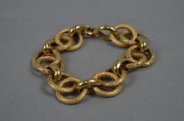 A MODERN LARGE FANCY HOLLOW LINKED BRACELET, textured and polished links, measuring approximately