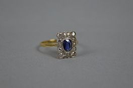 AN EARLY 20TH CENTURY SAPPHIRE AND DIAMOND RECTANGULAR CLUSTER RING, estimated old eight and Swiss