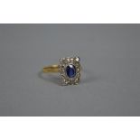 AN EARLY 20TH CENTURY SAPPHIRE AND DIAMOND RECTANGULAR CLUSTER RING, estimated old eight and Swiss