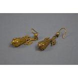 A PAIR OF VICTORIAN EAR PENDANTS, tapered pippin drops, decorated with applied bead and twist wire