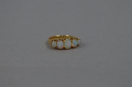 A MID 20TH CENTURY HALF HOOP OPAL RING, opals graduating in size, ring size N, hallmarked 18ct gold,