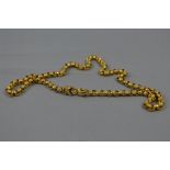 AN EARLY VICTORIAN GOLD CHAIN, round star patterned belcher links to a hand clasp with a turquoise