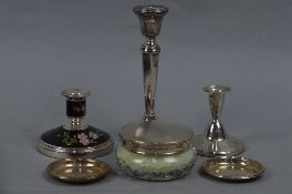 AN ELIZABETH II SILVER AND BLACK ENAMEL DWARF CANDLESTICK, decorated with dog roses, maker Adie