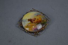 A ROYAL WORCESTER HARRY STINTON CIRCULAR PLAQUE BROOCH, decorated with two Highland Cattle in a