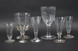 TWO LATE 18TH CENTURY ALE GLASSES, one with wrythen bowl, height approximately 13cm, another with