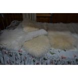 FOUR SHEEPSKIN RUGS (4)