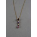 A 9CT AMEYTHST THREE DROP NECKLACE, approximate weight 1.8 grams