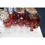A SUITE OF RUBY COLOURED GLASSES (14), a cut glass decanter and two other glass items