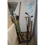 A QUANTITY OF GARDEN TOOLS, including pick axe, roof rack, spades, etc