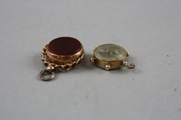 TWO 9CT GOLD HARDSTONE SWIVEL FOBS, together with a 9ct compass fob, total weight approximately 9.