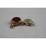 TWO 9CT GOLD HARDSTONE SWIVEL FOBS, together with a 9ct compass fob, total weight approximately 9.