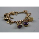 A 9CT CHARM BRACELET WITH VARIOUS CHARMS, total weight approximately 29.0 grams