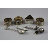 FOUR SILVER NAPKIN RINGS, spoon, rattle and mother of pearl fruit knife (7)