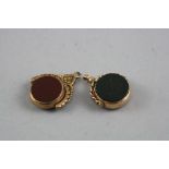 TWO GOLD HARDSTONE SWIVEL FOBS, total approximate weight 11.8 grams