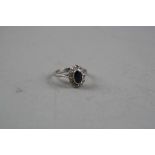 AN 18CT SAPPHIRE AND DIAMOND RING, ring size N, total approximate weight 4.7 grams (ring unmarked,