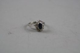 AN 18CT SAPPHIRE AND DIAMOND RING, ring size N, total approximate weight 4.7 grams (ring unmarked,
