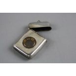 A SILVER VESTA CASE BIRMINGHAM 1925, set with a compass