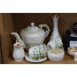 A GROUP OF BELLEEK, to include teapot decorated in shells and coral, a milk jug and matching sugar