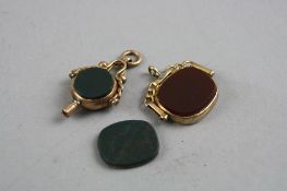 A GOLD HARDSTONE SWIVEL FOB (s.d) and a gold hardstone watchkey , approximate total weight 12 grams