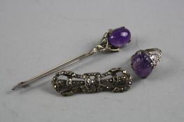 THREE PIECES OF SILVER JEWELLERY, to include an Amethyst carved ring, an Amethyst brooch and another