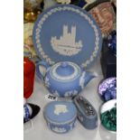 FOUR PIECES OF WEDGWOOD BLUE JASPERWARE, to include teapot, table lighter etc (4)