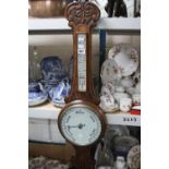 AN EARLY 20TH CENTURY OAK CASED ANEROID BAROMETER, THERMOMETER SCALE (a.f) together with a vintage
