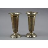 A PAIR OF SILVER FLUTED VASES
