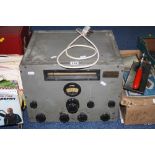 A WWII ERA BRITISH POSSIBLY RADIO RECEIVER, large oblong with various control knobs and switches,