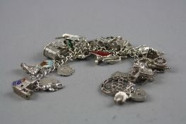A SILVER CHARM BRACELET WITH VARIOUS CHARMS, approximate weight 77 grams