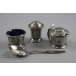 A LIBERTY TUDRIC THREE PIECE CRUET SET, and seperate silver spoon (4)