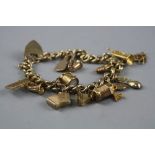 A 9CT CHARM BRACELET, with various charms, total weight approximately 41.2 grams