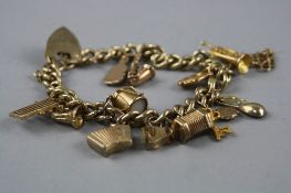 A 9CT CHARM BRACELET, with various charms, total weight approximately 41.2 grams