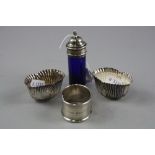 A PAIR OF SILVER SALTS, NAPKIN RING AND PEPPER (4)