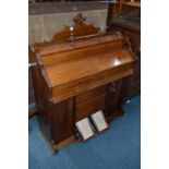 A SLIM MAHOGANY PUMP ORGAN, 'The Little Gem'