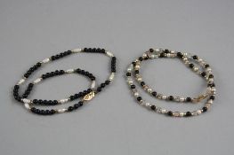TWO NECKLACES, one with a 14ct clasp and the other with a 9ct clasp