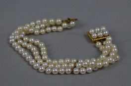 A LATE 20TH CENTURY THREE ROW CULTURED PEARL BRACELET, three rows of Akoya cultured pearl strung