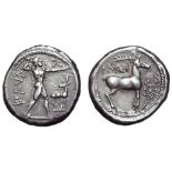 Bruttium, Kaulonia AR Stater. Circa 450-445 BC. Apollo, naked, advancing right, holding a branch