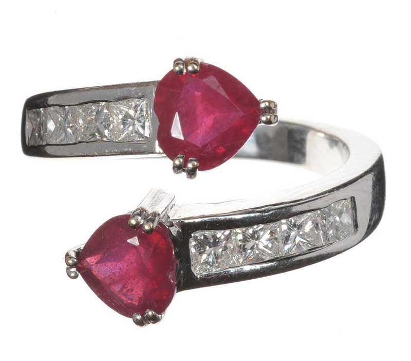 18CT WHITE GOLD RUBY AND DIAMOND CROSS-OVER RING