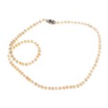 STRAND OF FRESHWATER PEARLS WITH A DIAMOND-SET STERLING SILVER CLASP