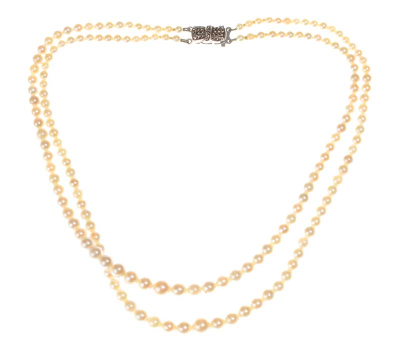 DOUBLE STRAND OF GRADUATED CULTURED PEARLS WITH A STERLING SILVER MARCASITE-SET CLASP