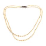 DOUBLE STRAND OF GRADUATED CULTURED PEARLS WITH A STERLING SILVER MARCASITE-SET CLASP