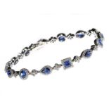 18CT WHITE GOLD SAPPHIRE AND DIAMOND CLUSTER BRACELET