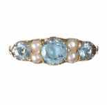 9CT GOLD RING SET WITH AQUAMARINE AND SEED PEARL IN AN EDWARDIAN STYLE
